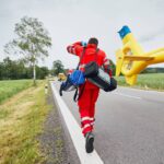 Emergency services arrives in a rural area by helicopter